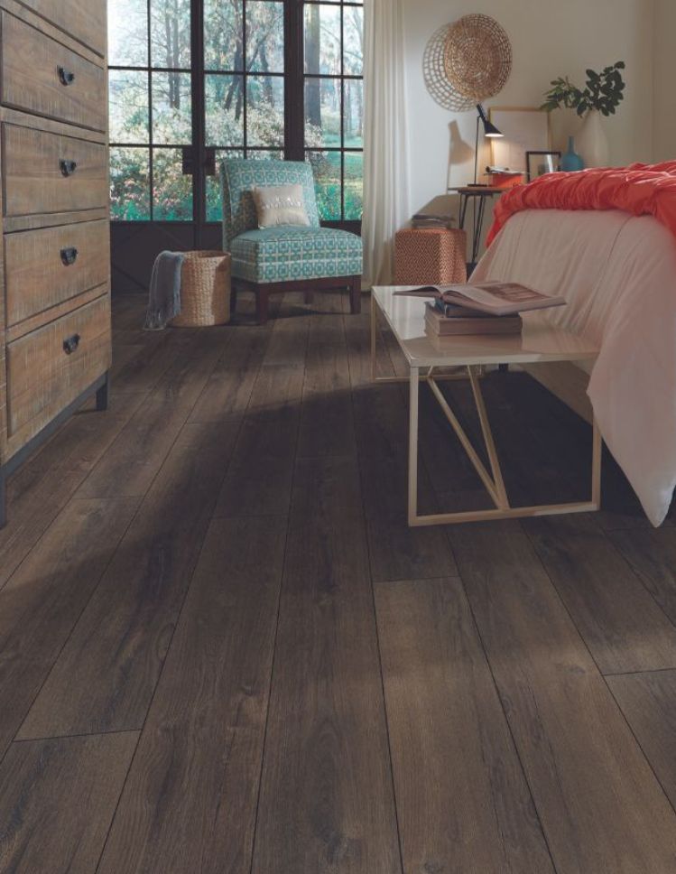luxury vinyl plank flooring in a cozy bedroom