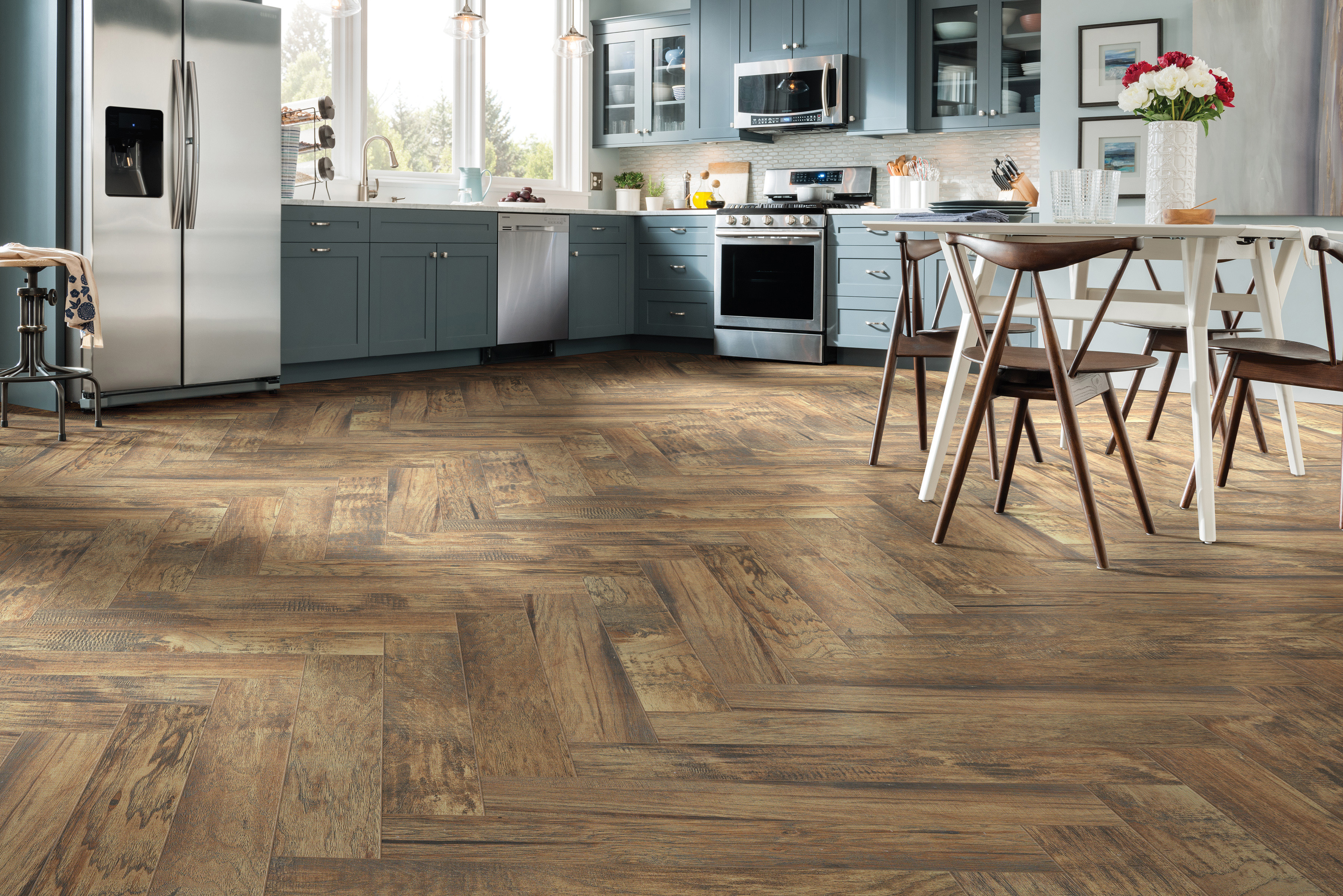 Herringbone style hardwood floors in a kitchen