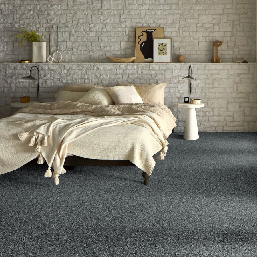 carpet in a bedroom with stone accent wall in Southaven, MS