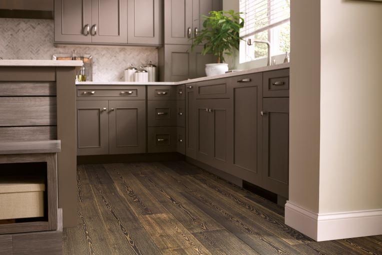 dark stained hardwood flooring in a monochromatic kitchen