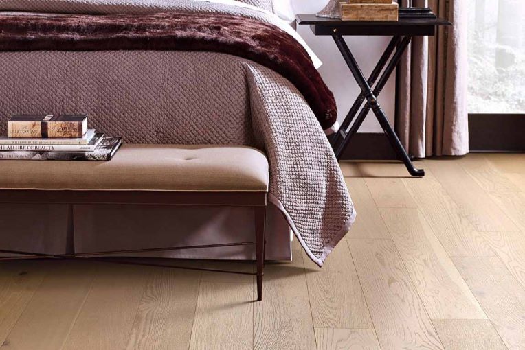 light hardwood floors in a cozy bedroom