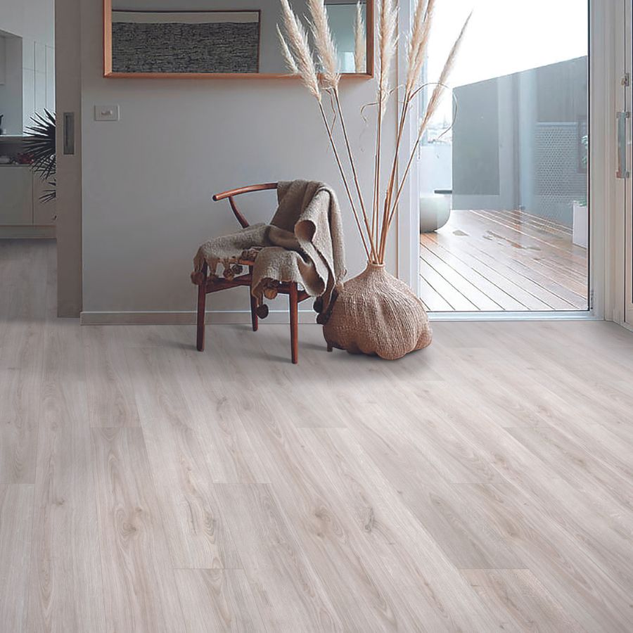 Wood-look laminate in home, plant, window, and chair with blanket